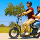 The Razor EcoSmart Cargo carrying a driver and a passenger sitting on the back.